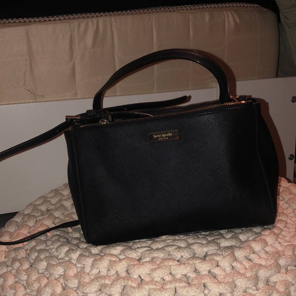Black leather Kate Spade purse with double zippers on side